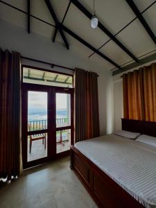 A bed or beds in a room at K Beach Resort