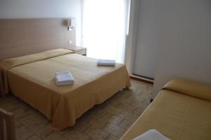 Postel nebo postele na pokoji v ubytování Hotel Caesar
