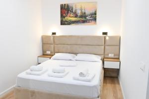 Ένα ή περισσότερα κρεβάτια σε δωμάτιο στο Lois Apartment
