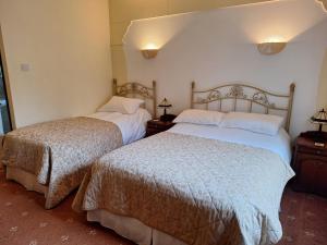 Postel nebo postele na pokoji v ubytování Corthna Lodge