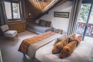 Postel nebo postele na pokoji v ubytování Chalet Hôtel Les Airelles