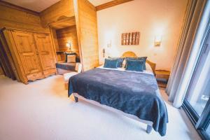 Postel nebo postele na pokoji v ubytování Chalet Hôtel Les Airelles