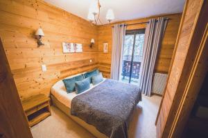 Postel nebo postele na pokoji v ubytování Chalet Hôtel Les Airelles + 33 fotografií