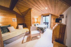 Postel nebo postele na pokoji v ubytování Chalet Hôtel Les Airelles