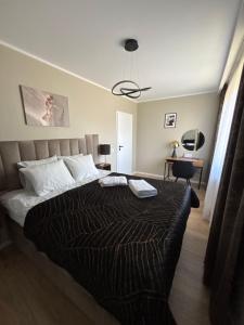Postel nebo postele na pokoji v ubytování Apartament Symsar