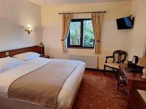 Postel nebo postele na pokoji v ubytování Corthna Lodge