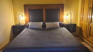 En eller flere senge i et værelse på Casa Alba