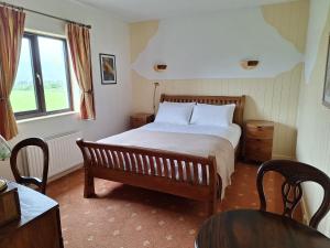 Postel nebo postele na pokoji v ubytování Corthna Lodge