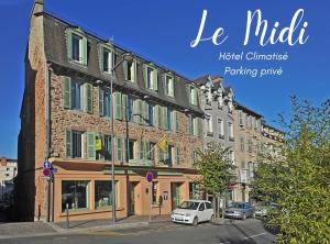 a building with cars parked in front of it at Logis Hôtel Restaurant du Midi - Rodez Centre in Rodez