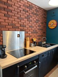 Kuchyň nebo kuchyňský kout v ubytování Valmy Cosy - Appartement entier - Hypercentre