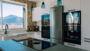 Kuchyň nebo kuchyňský kout v ubytování LyriosHomes Cortijo San Isidro