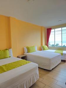Postel nebo postele na pokoji v ubytování Coco Beach