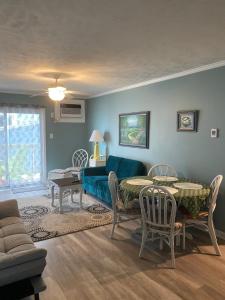 a living room with a couch and a table at North Topsail- Flip Flops in North Topsail Beach