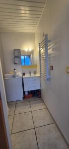 a small bathroom with a sink and a window at Studio 181 Albion Residence Beautiful view and pool! in Aix-les-Bains
