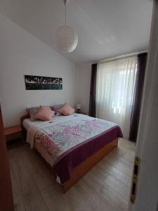 Postel nebo postele na pokoji v ubytování Apartment Ivkica