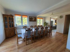 a dining room with a table and chairs at Agro u Murzyna cały dom in Trzemcha Górna