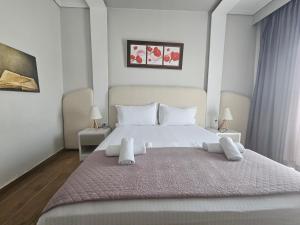 Postel nebo postele na pokoji v ubytování Hotel Pini