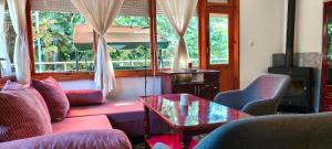 a living room with a couch and a table at Summerbreath Apartments in Ahtopol