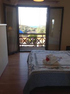 Ένα ή περισσότερα κρεβάτια σε δωμάτιο στο Paradise Villa