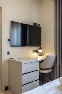 Μια τηλεόραση ή/και κέντρο ψυχαγωγίας στο Guesthouse Rooms Split