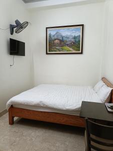 TV a/nebo společenská místnost v ubytování Hoàng Bách homestay