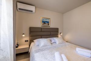 Ένα ή περισσότερα κρεβάτια σε δωμάτιο στο Guesthouse Rooms Split