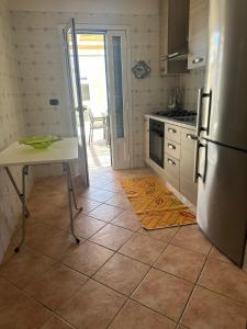 A kitchen or kitchenette at Tana Dell'Orso