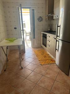 A kitchen or kitchenette at Tana Dell'Orso
