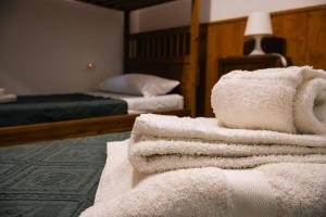 a pile of towels sitting on top of a room at Trulli al Chiaro di Luna in Putignano