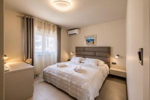 Ένα ή περισσότερα κρεβάτια σε δωμάτιο στο Guesthouse Rooms Split