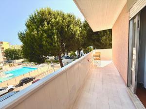a balcony of a house with a swimming pool at Hotel Blumen in San Benedetto del Tronto