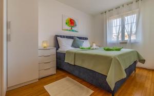 En eller flere senge i et værelse på Apartment Verena