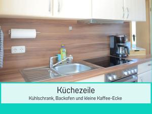 Kuchyň nebo kuchyňský kout v ubytování Meeresbrise & Sonnenschein Ihre Terrasse in Zinnowitz wartet!