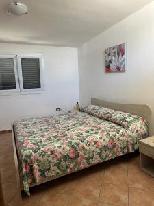 A bed or beds in a room at Tana Dell'Orso