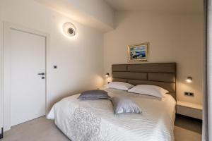 Ένα ή περισσότερα κρεβάτια σε δωμάτιο στο Guesthouse Rooms Split