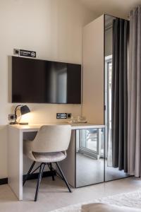 Μια τηλεόραση ή/και κέντρο ψυχαγωγίας στο Guesthouse Rooms Split