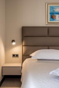 Ένα ή περισσότερα κρεβάτια σε δωμάτιο στο Guesthouse Rooms Split