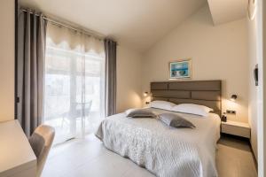 Ένα ή περισσότερα κρεβάτια σε δωμάτιο στο Guesthouse Rooms Split