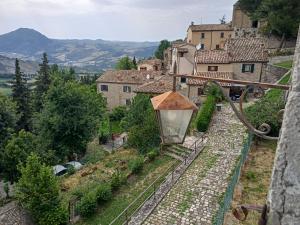 a view of a village with a street light at Giardino in piazza, casa in pietra a San Leo in San Leo