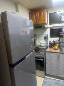 Η κουζίνα ή μικρή κουζίνα στο downtown Aparments