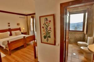Uma cama ou camas num quarto em Quinta de CasalMato