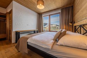 Ένα ή περισσότερα κρεβάτια σε δωμάτιο στο Apartman Brhliska