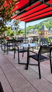 a row of tables sitting on top of a roof at Hotel La Baia in Cochem +10 photos