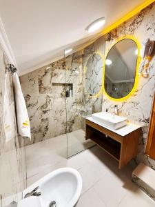 a bathroom with a sink and a mirror at Villa Zen Oasis in Golem +20 photos