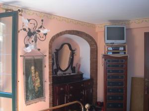 TV a/nebo společenská místnost v ubytování B&B Casa Armonia