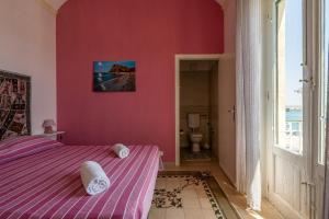 Postel nebo postele na pokoji v ubytování The Twins Rooms in Trapani 2