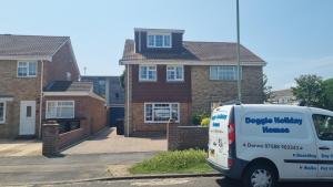 a van parked in front of a house at Spencer , 4 bed slp 8 semi in Lee On The Solent in Lee-on-the-Solent