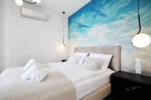 Katil atau katil-katil dalam bilik di Perła Mórz Apartament 75