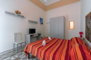 Postel nebo postele na pokoji v ubytování The Twins Rooms in Trapani 2