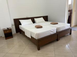 a bed with two pillows on it in a room at Anmaor in Qeparo +39 photos
